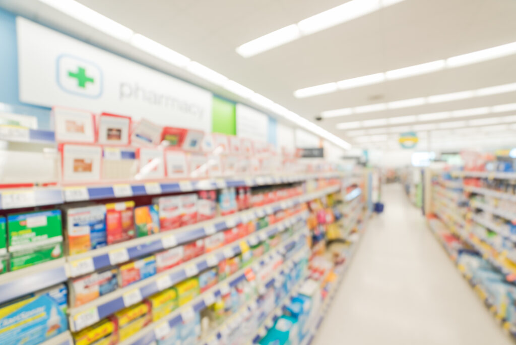 The inside of pharmacy blurred in the background.