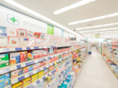 The inside of pharmacy blurred in the background.