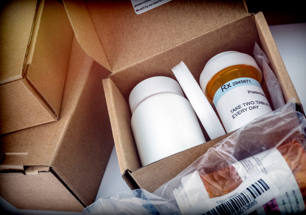 Several boxes with prescriptions inside them.